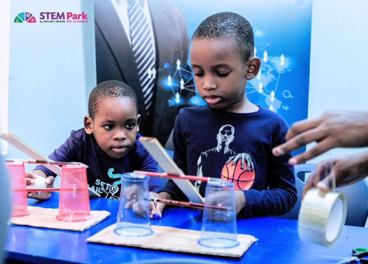 Children using measurement and construction skills during a mathematics activity